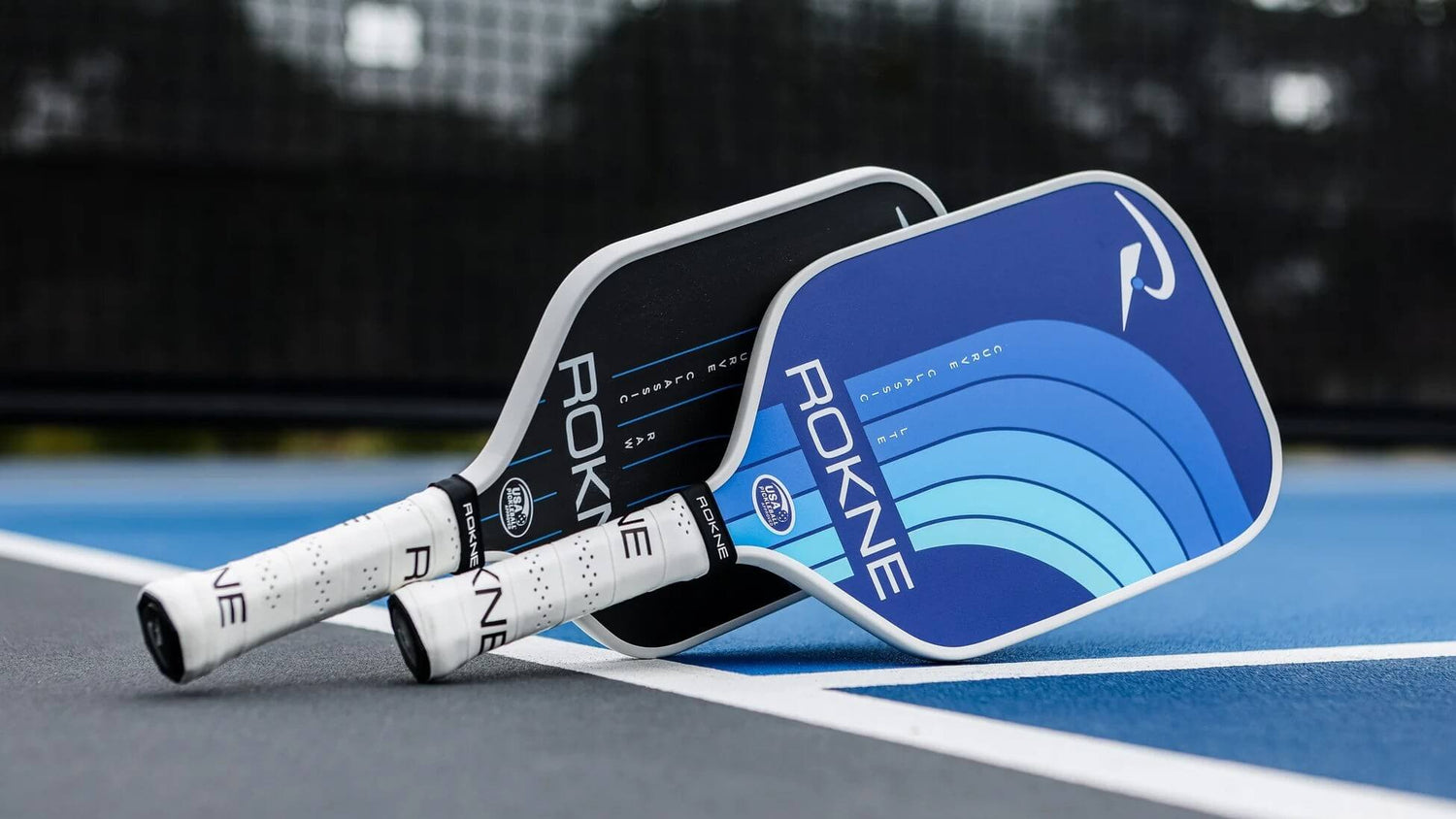 Rokne pickleball paddles in blue and black